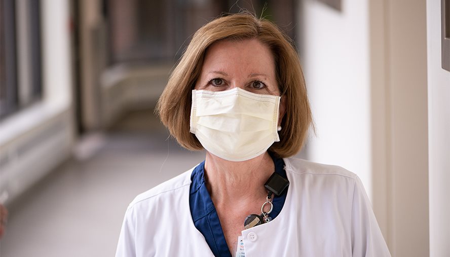 Physician wearing a mask