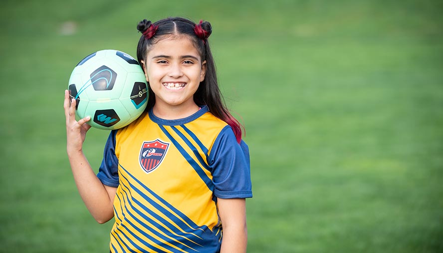 Young patient with her soccer ball