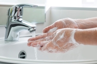 Washing hands at sink