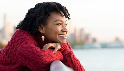 woman smiling and looking to the future
