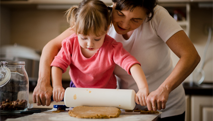 Mother and daughter baking together