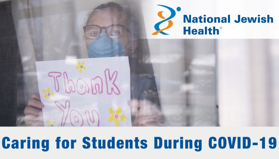 Young child holding thank you sign