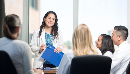 Group of National Jewish Health doctors sitting around a table