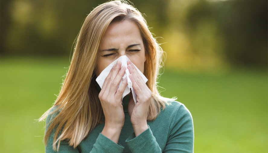 Woman sneezing