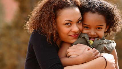 mother hugging her child