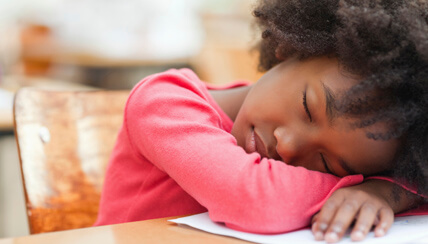 child sleeping in class